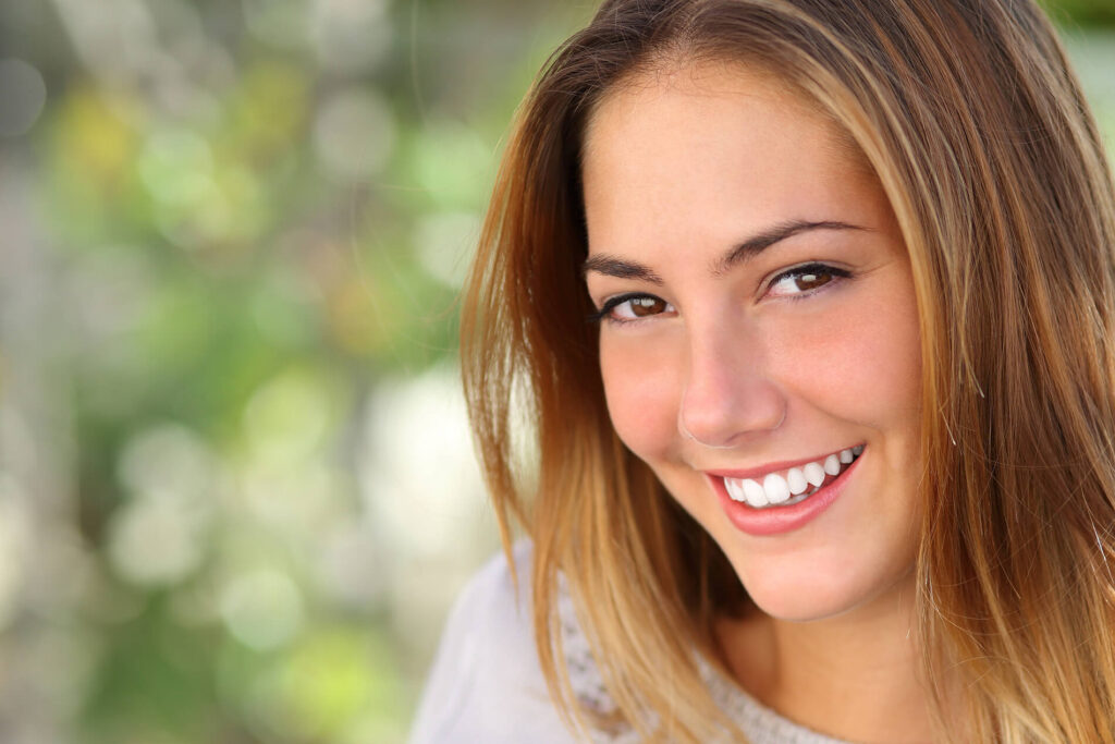 Smiling Young Female Blurred Background